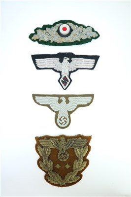 Lot 498 - A German Third Reich RMBO (Eastern People’s) Sleeve Eagle and other patches (4)