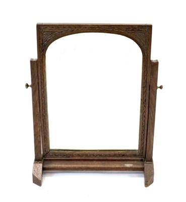 Lot 321 - A carved pale oak dressing mirror