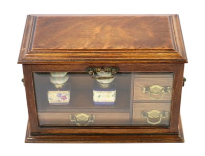 Lot 628 - A Victorian oak cased desk-top writing/ stationary cabinet