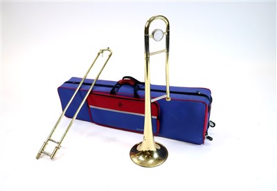 Lot 522 - A trombone with case