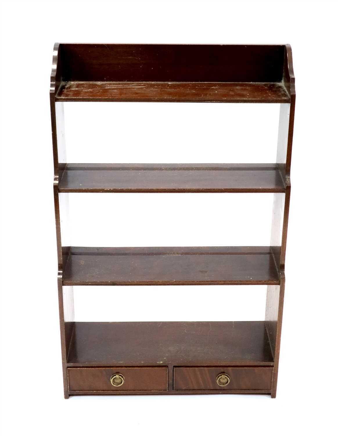 Lot 1016 - A small mahogany wall hanging waterfall bookcase