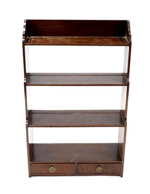 Lot 1016 - A small mahogany wall hanging waterfall bookcase