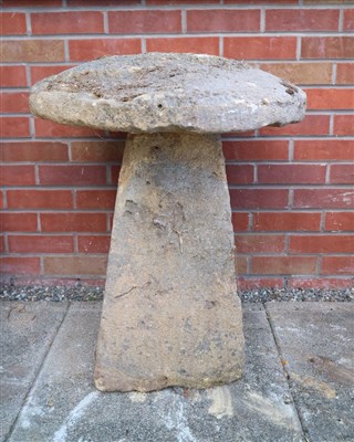 Lot 773 - An antique cut weathered limestone staddle stone and cap
