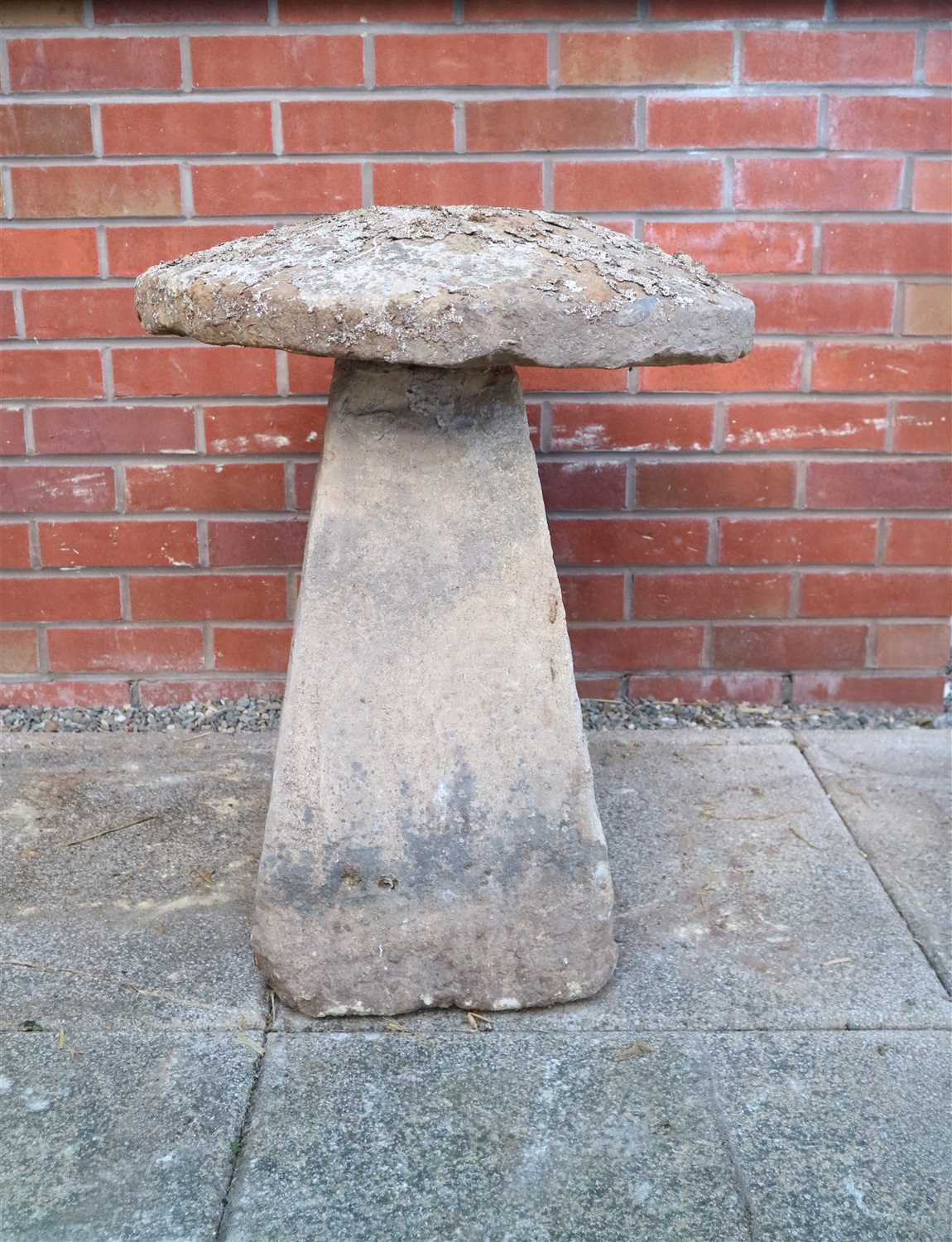 Lot 779 - An antique cut weathered limestone staddle stone and cap