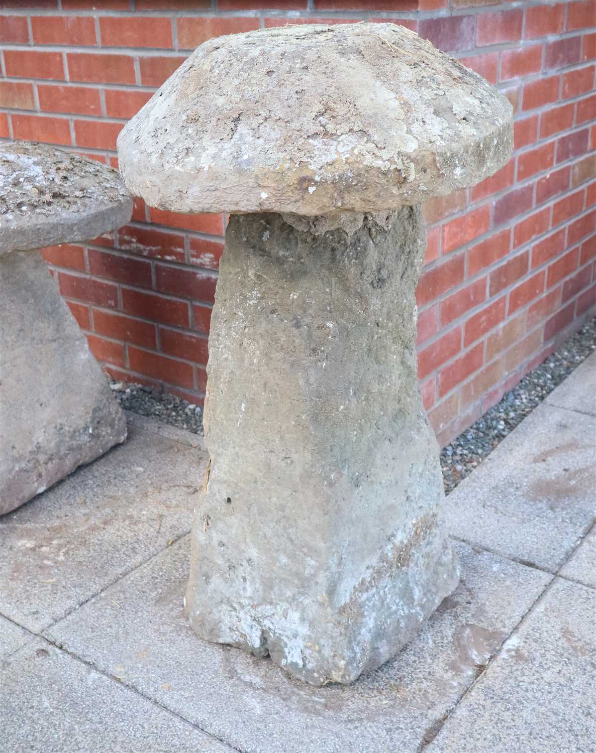 Lot 775 - An antique cut weathered limestone staddle stone and cap