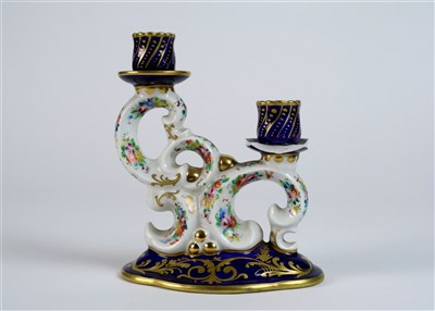 Lot 205 - French porcelain double candlestick