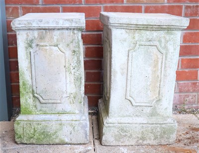 Lot 440 - A pair of weathered simulated limestone plinth bases and a pair of garden planters