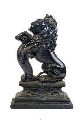 Lot 603 - A 19th century cast iron door stop in form of a rampant lion