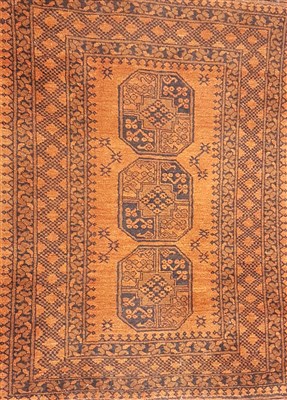 Lot 1051 - A small brick ground eastern wool rug