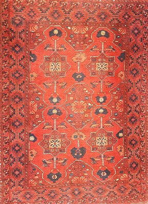 Lot 1052 - A small old eastern woven wool rug