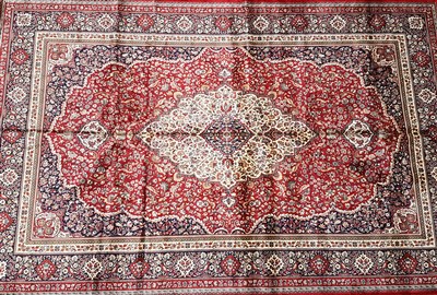 Lot 1039 - A red ground Kashmir carpet