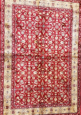 Lot 1046 - A red ground Kashmir rug