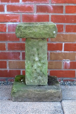 Lot 436 - A small weathered limestone birdbath