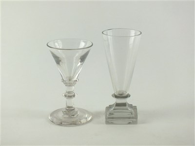 Lot 133 - An unusual 18th century dwarf ale firing glass and a 19th century wine glass