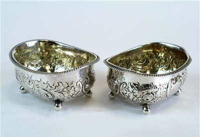 Lot 410 - A pair of silver salts with embossed decoration