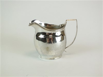 Lot 122 - A George III silver cream jug