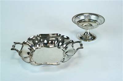 Lot 124 - A two handled shallow silver bowl and a pedestal bowl