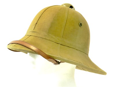 Lot 477 - A Second World War Wolseley pattern tan cotton covered pith/sun helmet