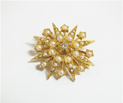 Lot 44 - A seed pearl and diamond brooch