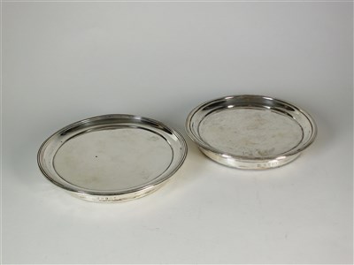 Lot 215 - Two silver mounted coasters/stands