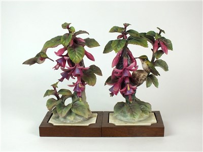 Lot 86 - A pair of Royal Worcester models of Ruby-Throated Hummingbirds on Fuschia