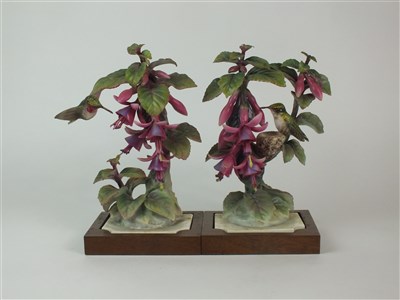 Lot 86 - A pair of Royal Worcester models of Ruby-Throated Hummingbirds on Fuschia