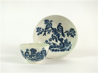 Lot 52 - A Caughley Birds in Branches tea bowl and saucer