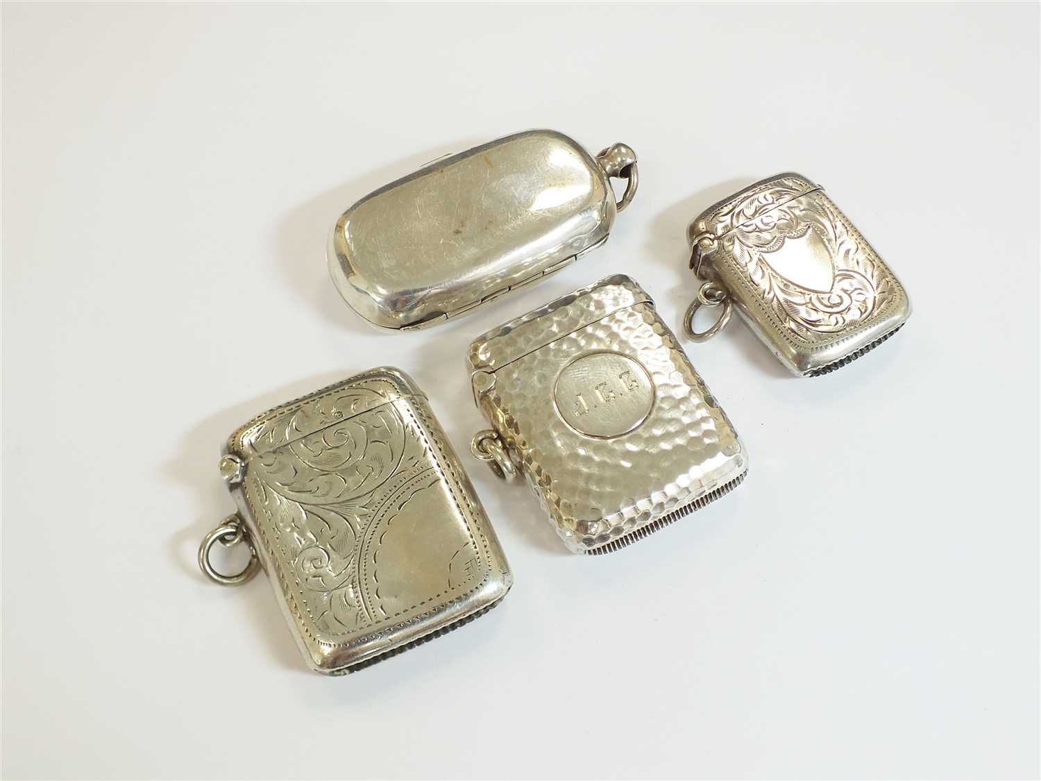 Lot 55 - Three silver vesta cases and a sovereign case
