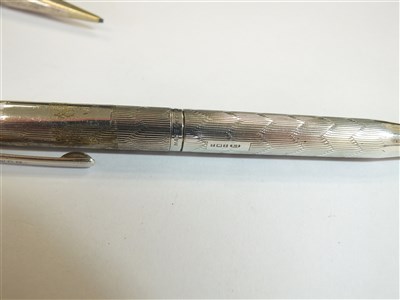 Lot 68 - Three silver retractable pencils