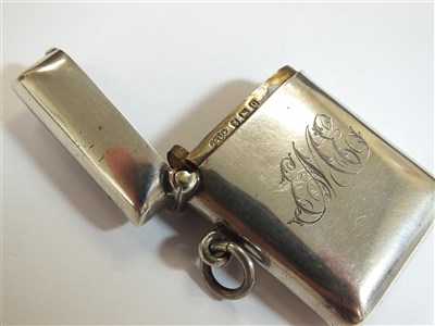 Lot 69 - A silver lighter and three silver vesta cases