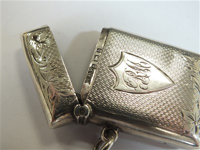 Lot 69 - A silver lighter and three silver vesta cases