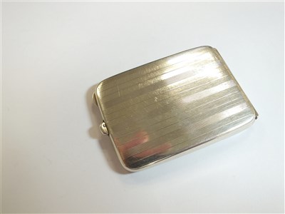 Lot 70 - A silver cigarette case and two vesta cases
