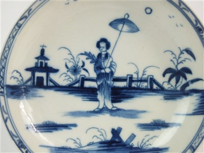 Lot 13 - A Caughley porcelain 'Girl with Parasol' tea bowl and saucer