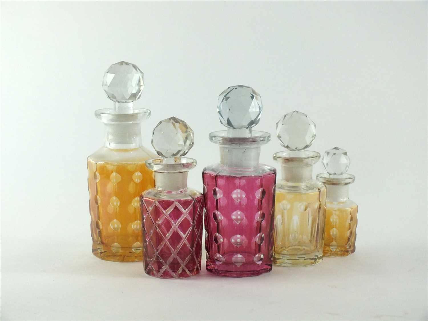 Lot 134 - Five Baccarat glass perfume bottles and stoppers