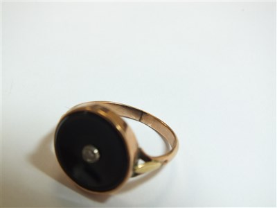 Lot 25 - An abalone shell ring and an onyx ring