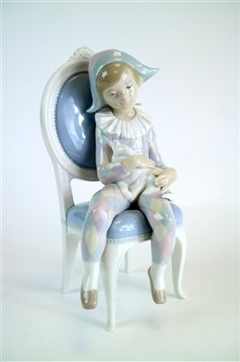 Lot 327 - Lladro model of a Harlequin boy and a cat