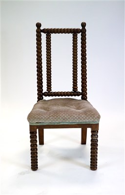 Lot 542 - A Victorian turned rosewood bobbin nursing chair