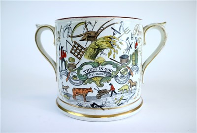 Lot 498 - A Staffordshire twin-handled Farmers Arms mug