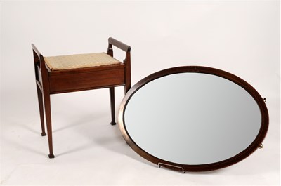 Lot 642 - An Edwardian upholstered mahogany piano stool and an Edwardian inlaid wall mirror