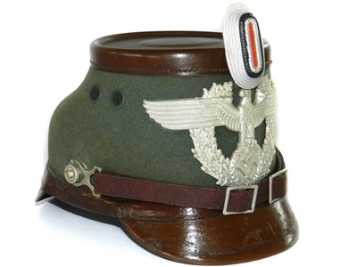 Lot 386 - A German Third Reich M1936 Schutzpolizei NCO Police Shako by Erel, Berlin