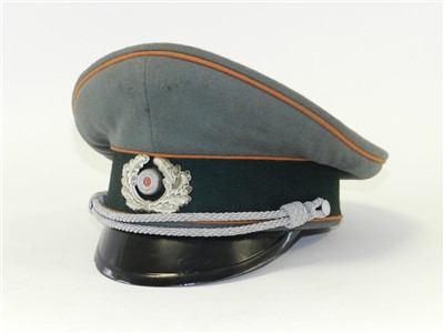 Lot 293 - A reproduction German Third Reich Army Field Police Officer’s visor cap