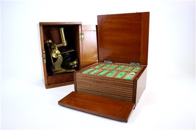 Lot 406 - Mahogany cased microscope and box of slides