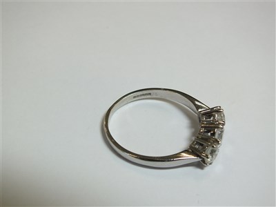 Lot 258 - An 18ct gold three stone diamond ring