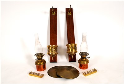 Lot 599 - A pair of wall-mounted mahogany and brass framed wall lamps