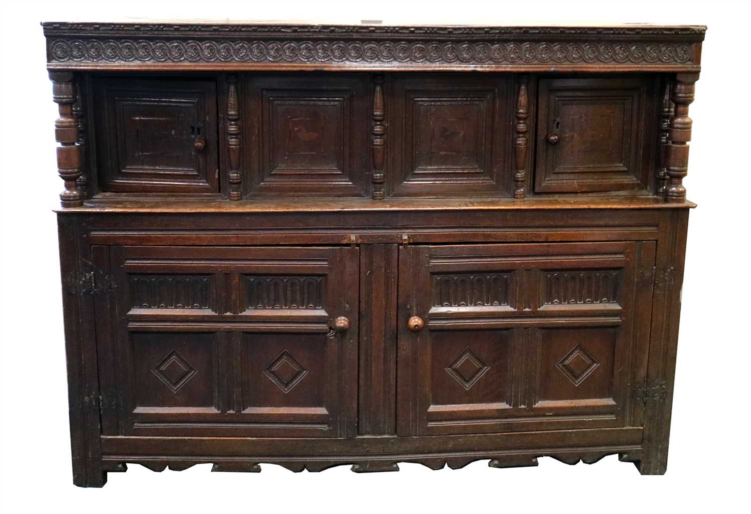 Lot 245 - A large 17th century and later country oak court cupboard
