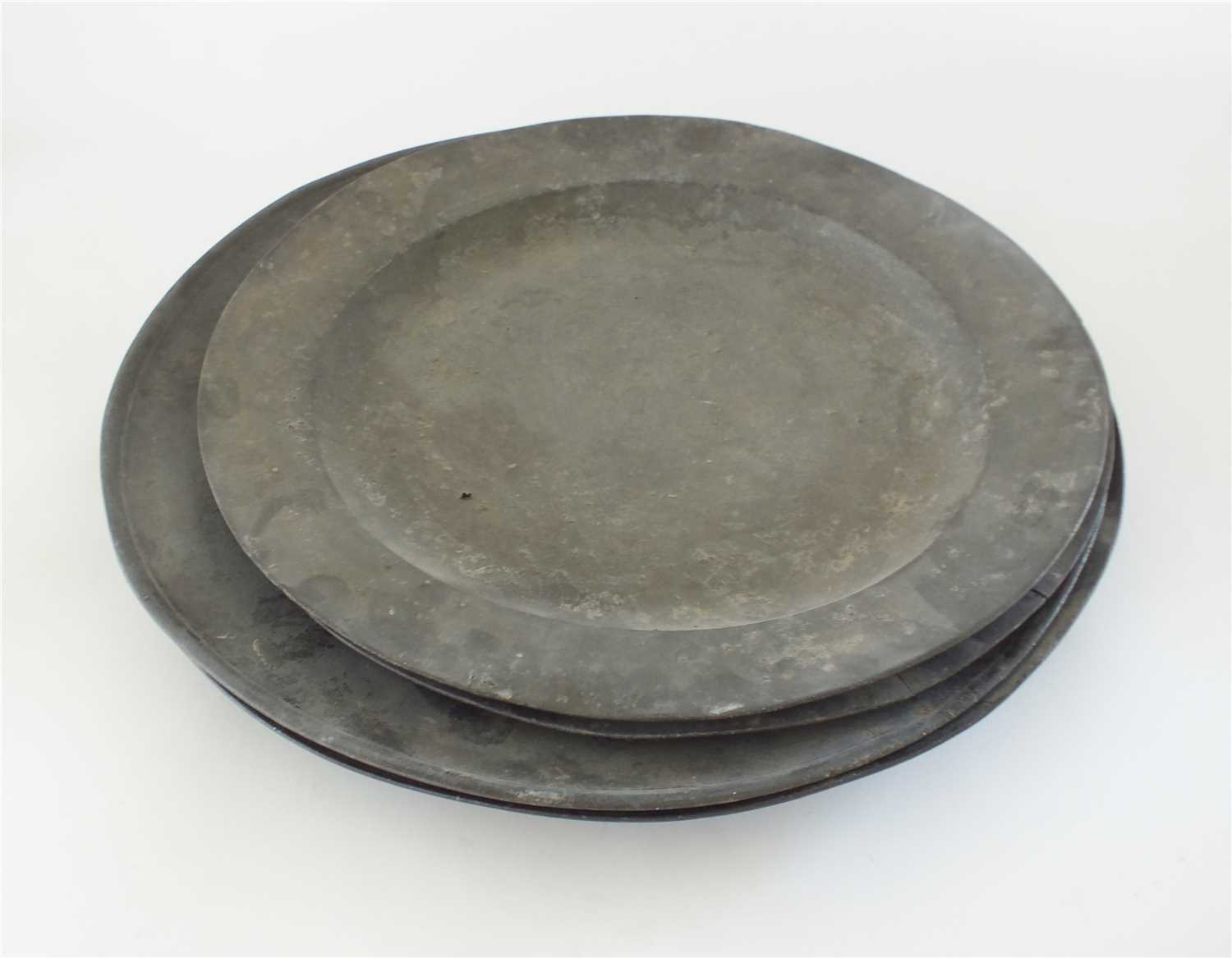 Lot 327 - Four pewter chargers