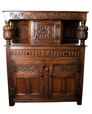 Lot 660 - An reproduction oak court cupboard in the old English style