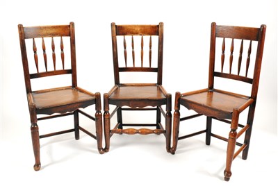 Lot 708 - Three associated 18th century country oak spindle-back chairs