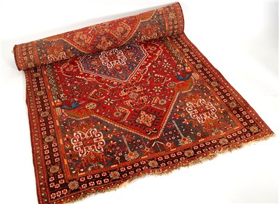Lot 606 - A red ground Eastern woven wool rug