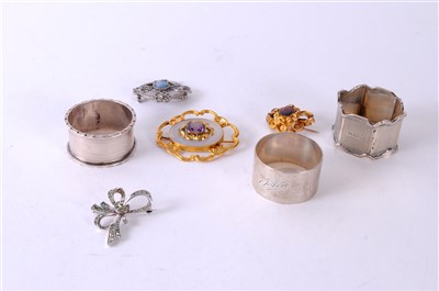 Lot 429 - Four brooches and three napkin rings